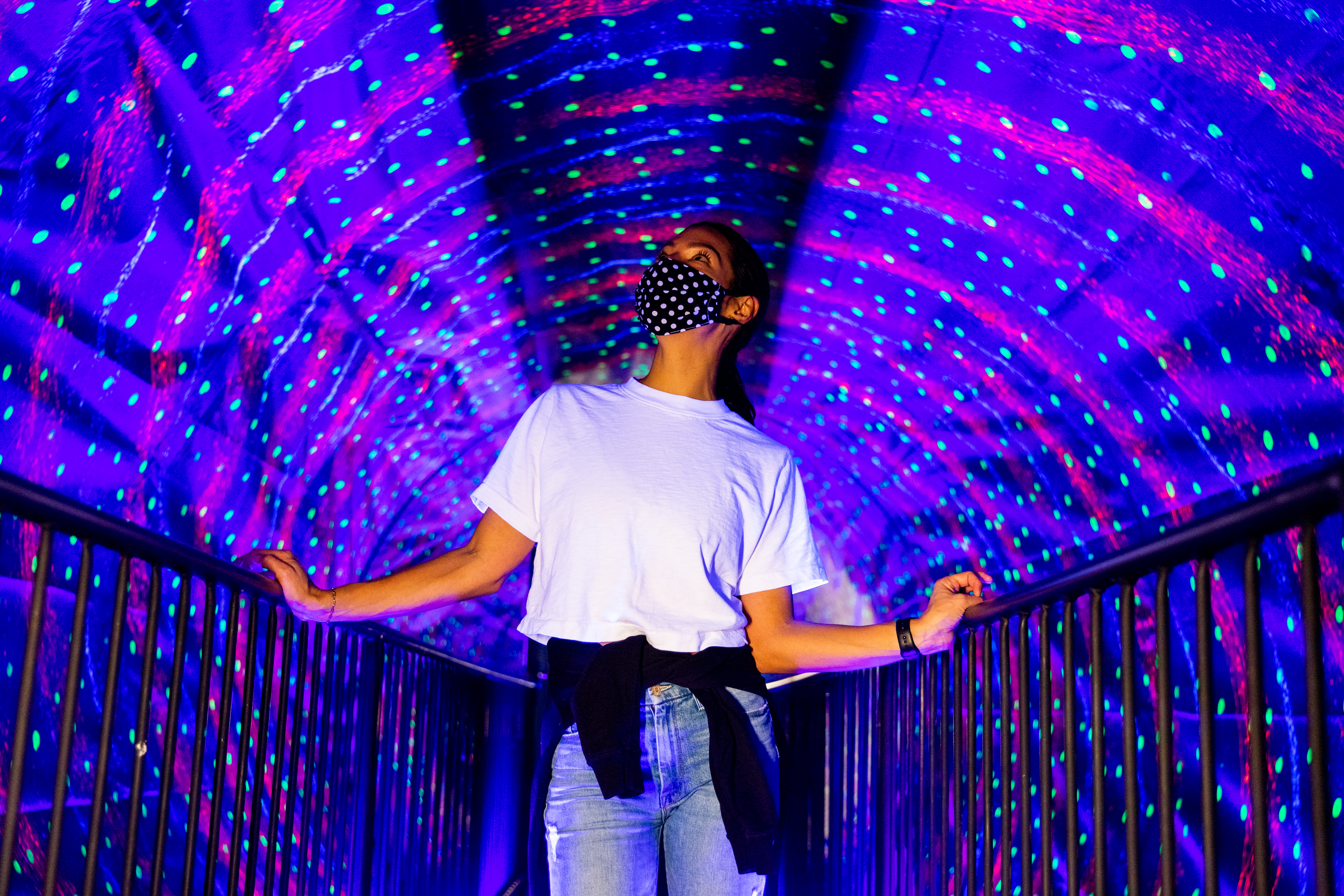 Person walking through tunnel at Museum of Illusions
