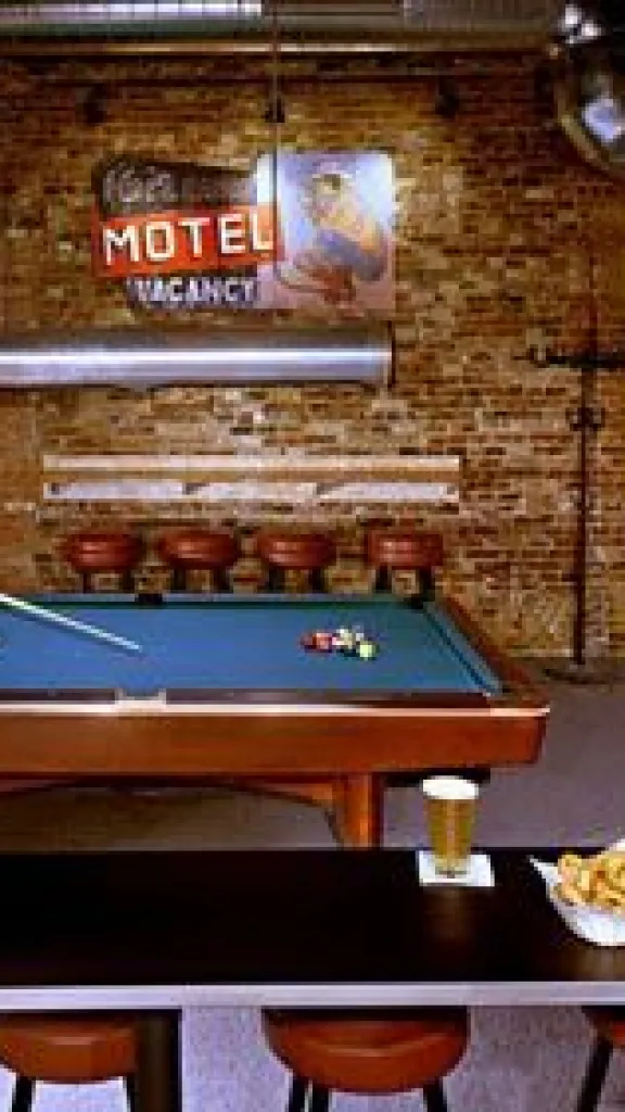 interior of Buffalo Billiards, with a pool table and snacks and drinks on a table