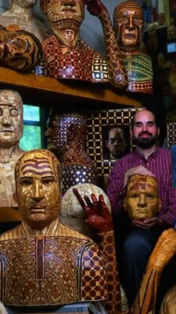 The artist surrounded by his sculptures
