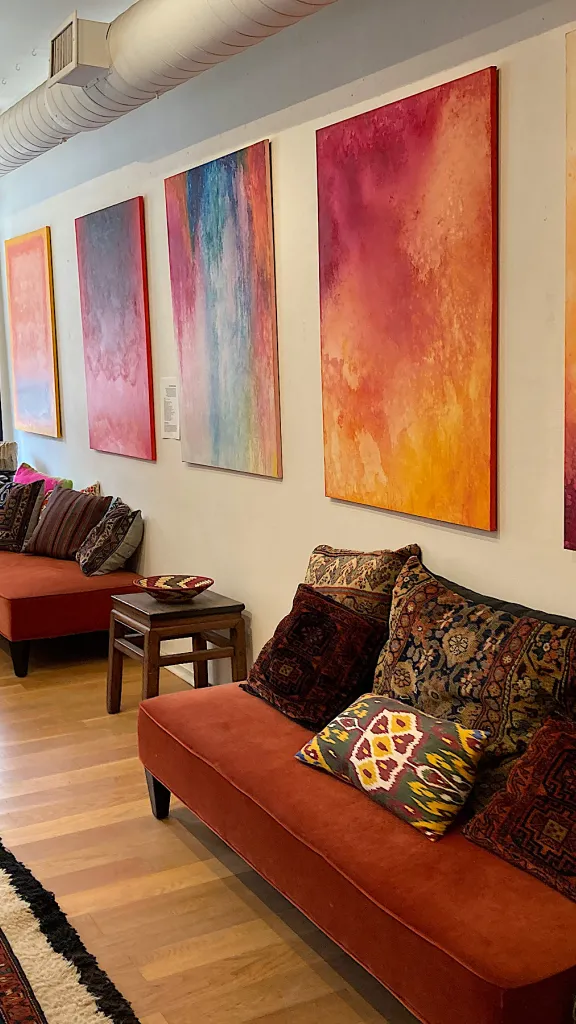 Interior of Gallery51 with artwork on walls and furniture and furnishings on display