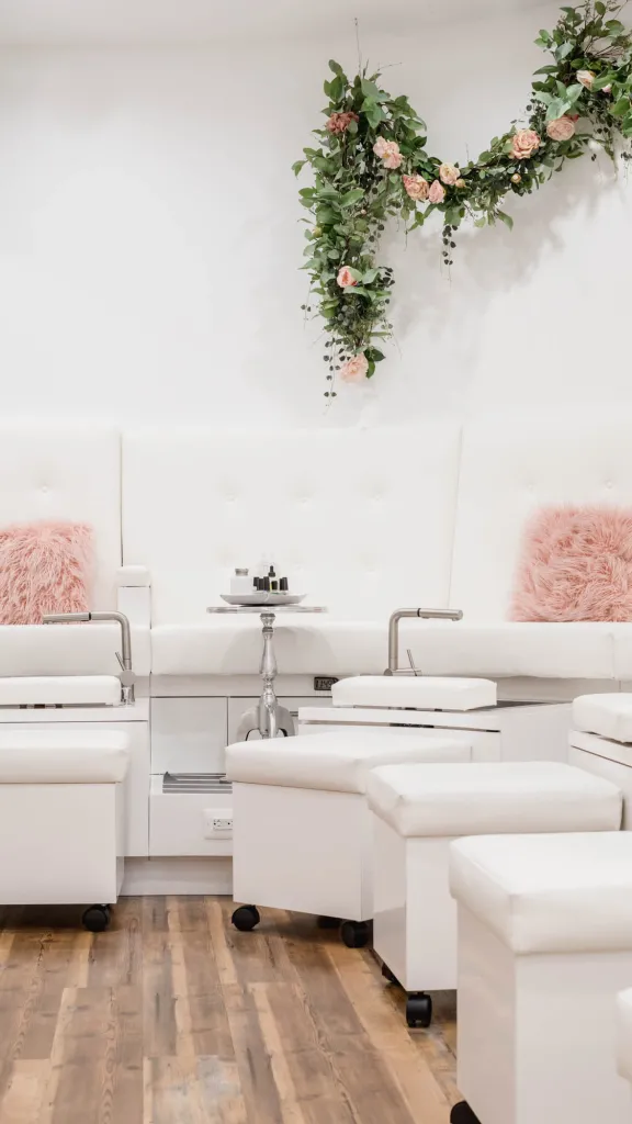Interior of Lacquer Lounge with white stations and pink fluffy pillows