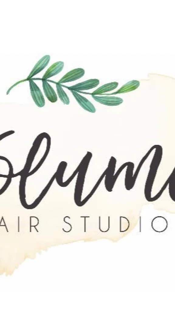 Volume Hair Studio logo with green leaf and black text