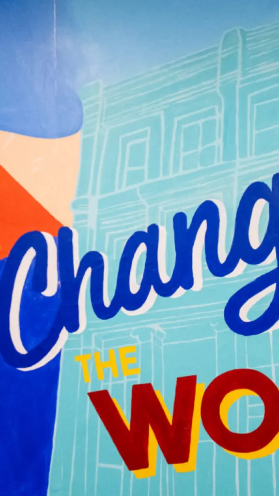 Mural at national Liberty Museum that reads "Liberty in Action Changes the Word"