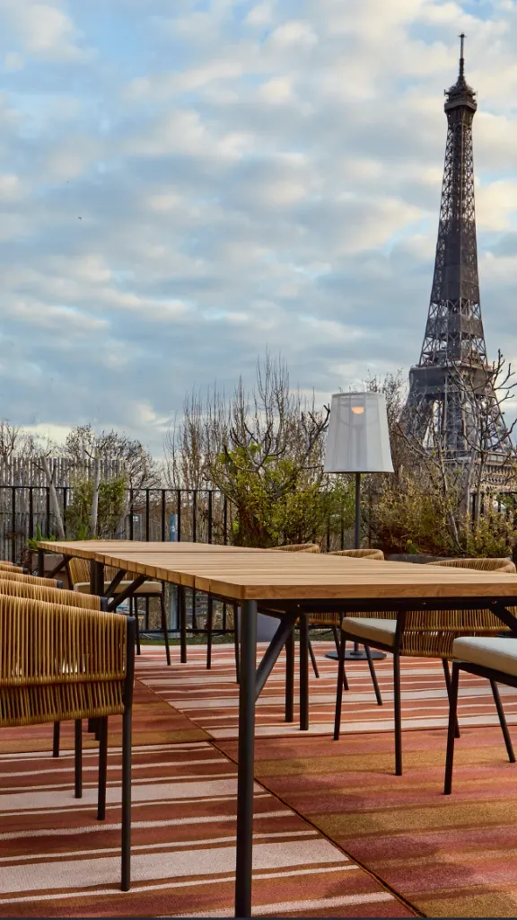 Outdoor furniture in Paris with Eiffel Tower in background