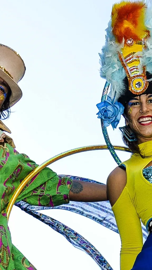 Two circus performers at Old City Fest in colorful costumes