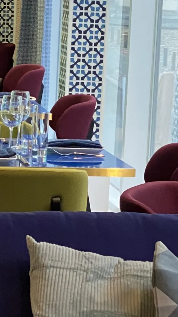 Tables and chairs inside of Positano Coast restaurant