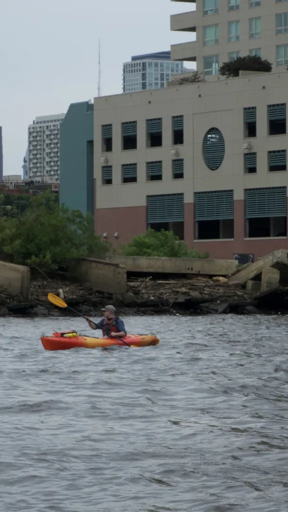 Two people kayaking in the Delaware River at Penn's Landing