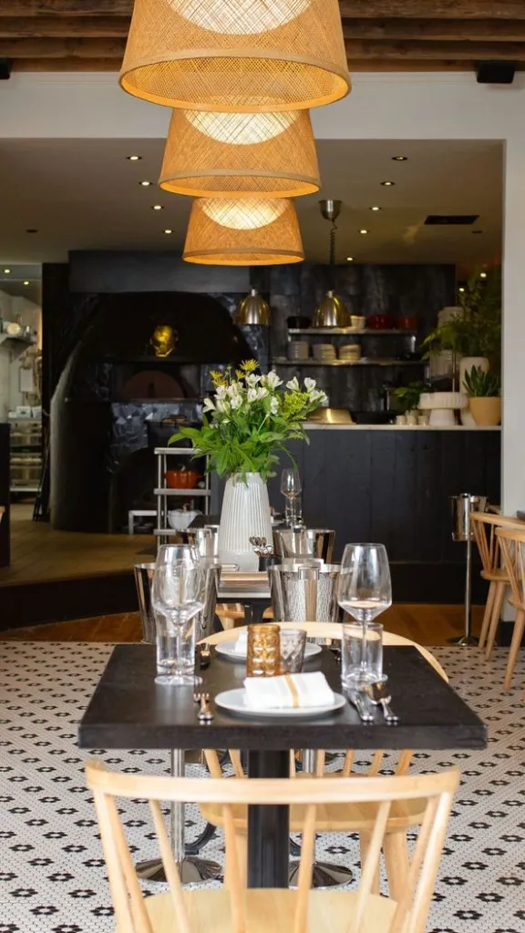 Interior of Forsythia restaurant with table and chairs set 