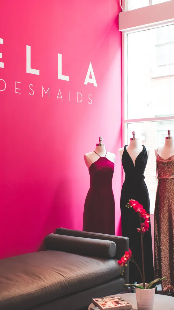 Six bridesmaids dresses on display on mannequins inside Bella Bridesmaids shop