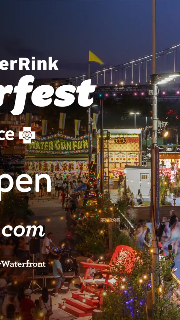 People skating at the Blue Cross RiverRink at night 