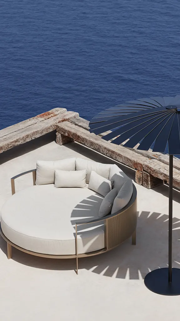 Outdoor furniture on patio along waterfront