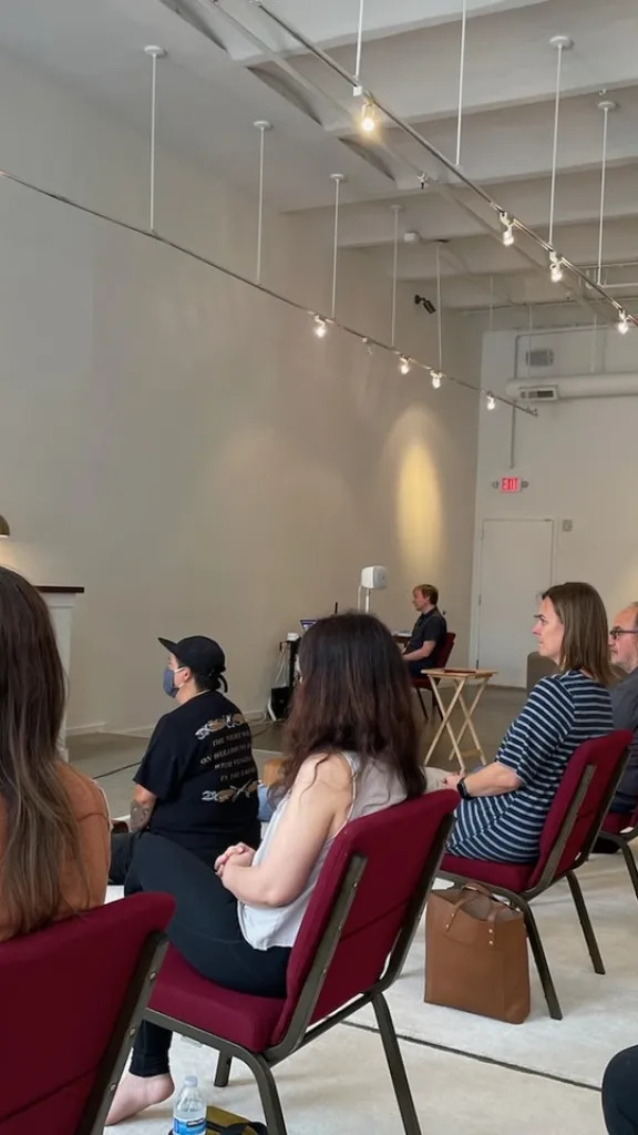 People sitting in a room for open house 