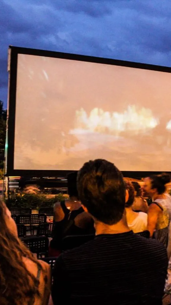 People watching outdoor movie 