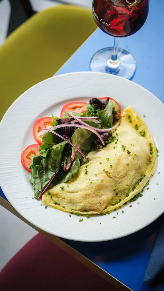 Omelette, salad, and a drink