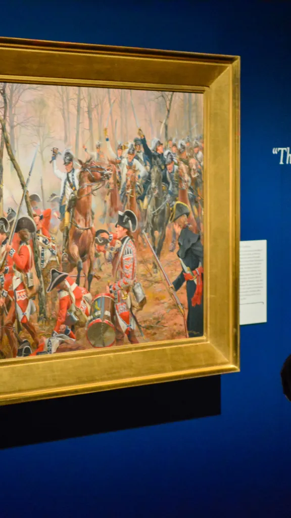 Person viewing artwork at the Museum of the American Revolution