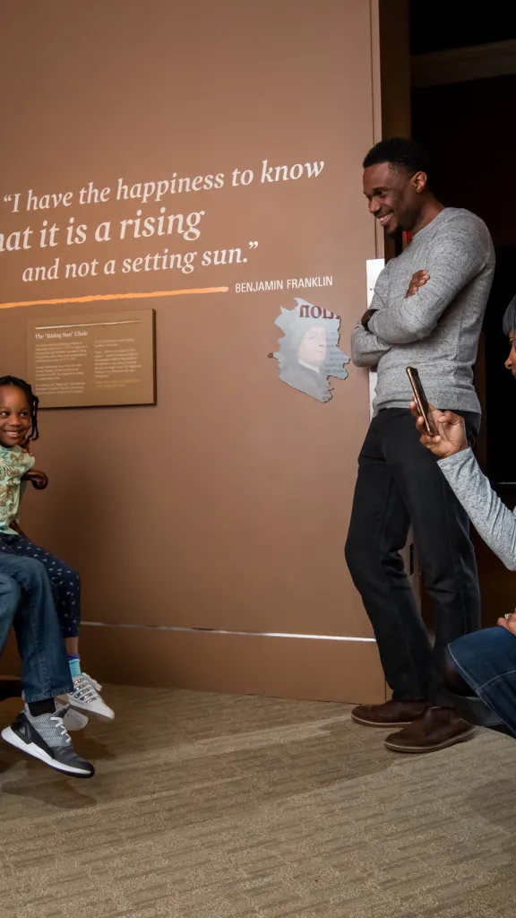 Two children taking photo at Museum of the American Revolution