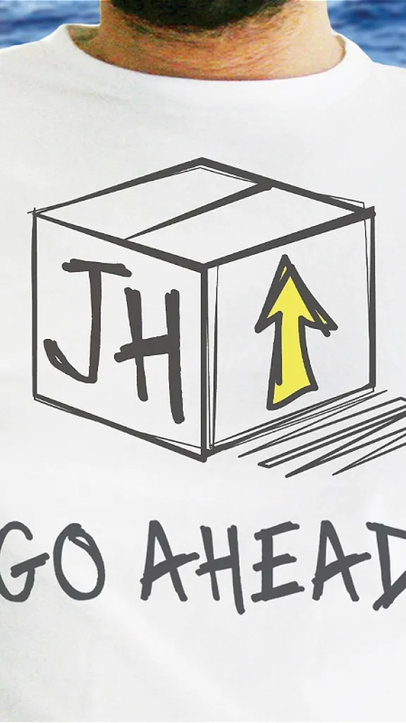 Person wearing white t-shirt that says "JH GO AHEAD"