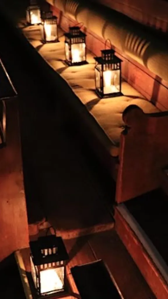 Arch Street Meeting House illuminated by candlelight