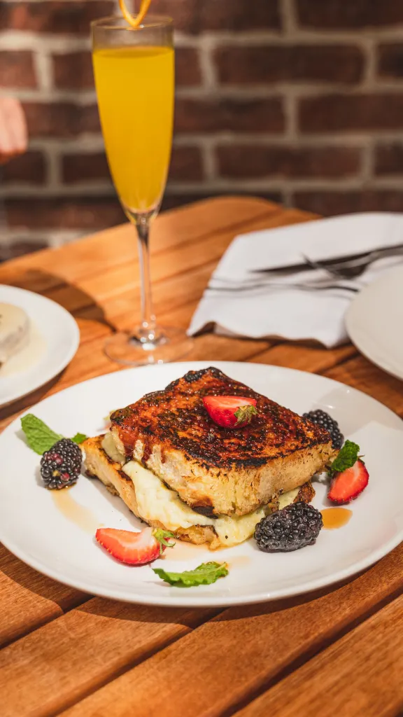 Two people eating brunch at Royal Boucherie
