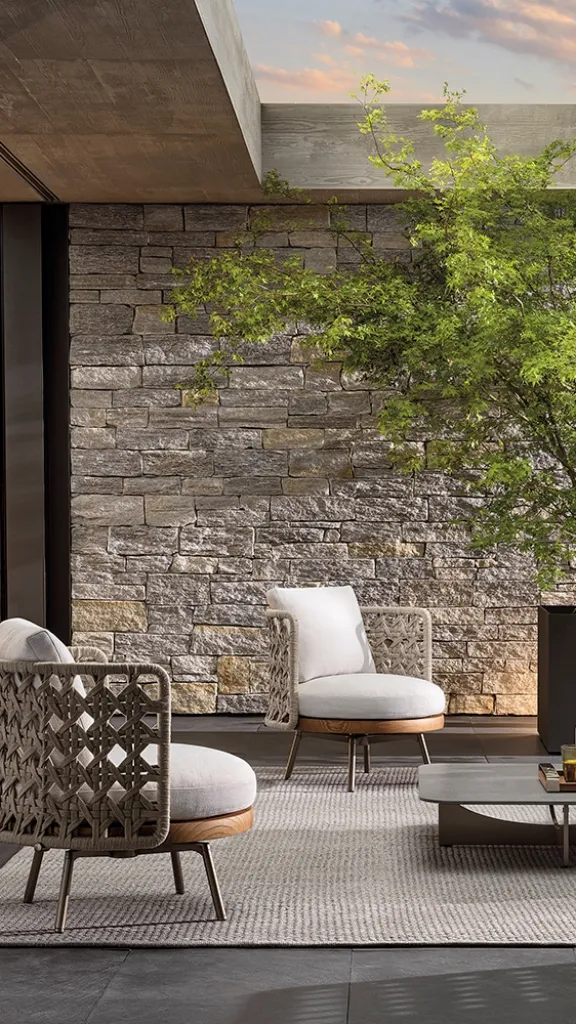 Outdoor furniture on patio with tree