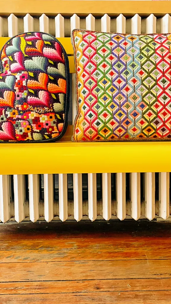 Heart shaped woven pillow on a bench