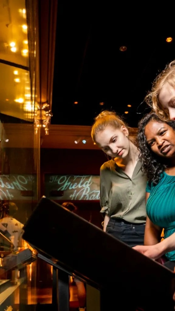 People observing exhibit at the Museum of the American Revolution