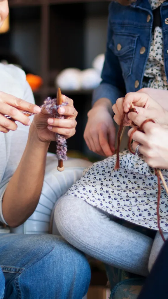 Photo of people knitting