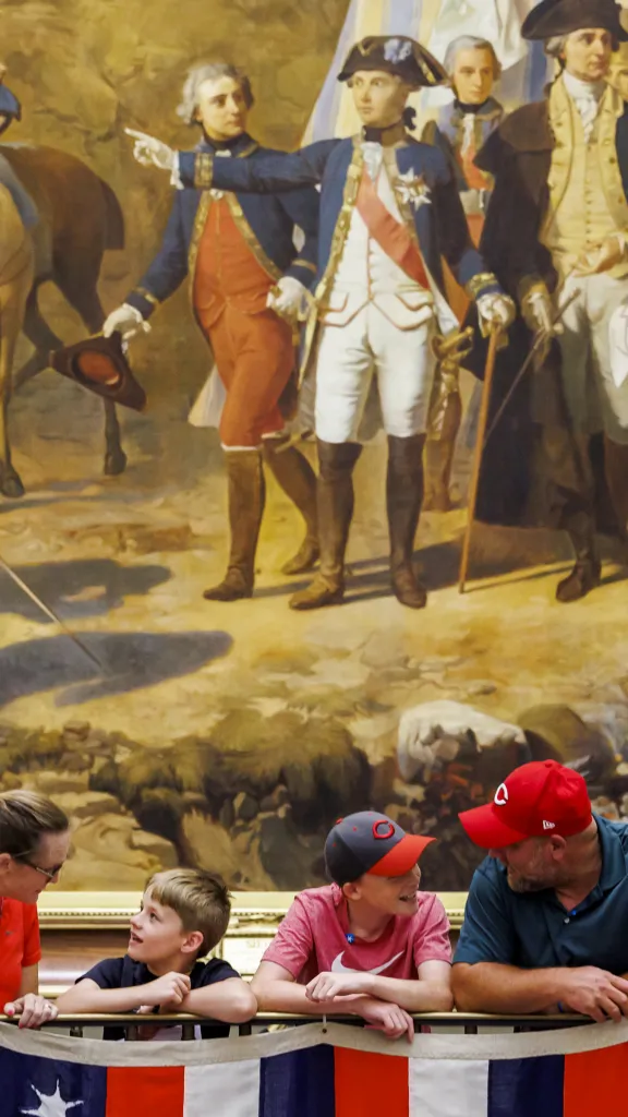 Family in front of American Revolution Painting