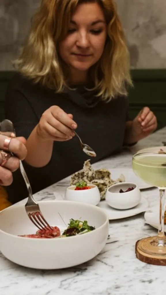 Guests eating at the bar at Forsythia