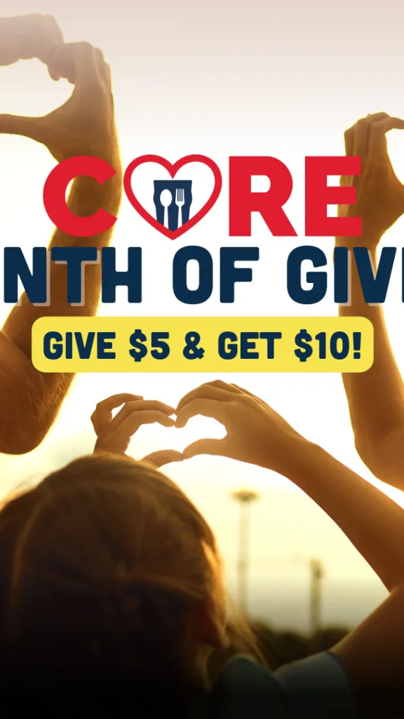 A young girl and her parents putting up their hands into heart shapes with the sky in the background