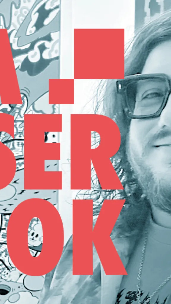 a photo of a man with glasses and a beard