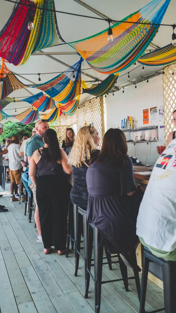 Patrons enjoy a drink at the newly opened area "The Lazy Hammock"