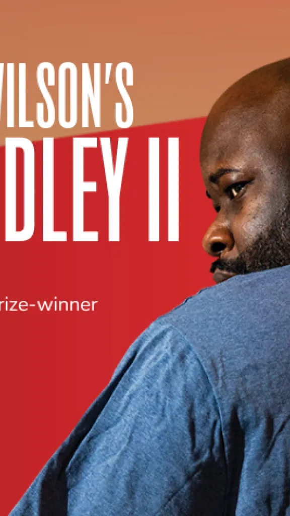 A Black man looks over his left shoulder. There as in illustrated crown drawn on the back of his shirt. Title Reads "August Wilson's King Hedley II" Credits read "Directed by Pulitzer Prize Winner James Ijames. Arden Theatre Co."