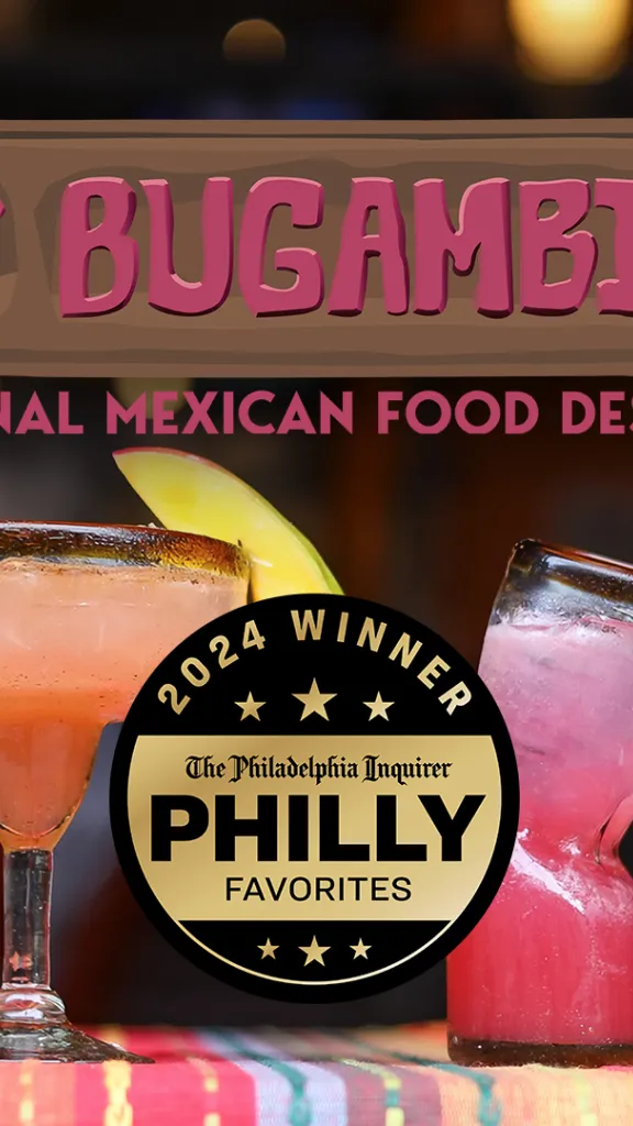 A table with a colorful tablecloth and a line of tasty margaritas and mixed drinks. Las Bugambilias - Traditional Mexican Food Desde 2007. 2024 Winner, The Philadelphia Inquirer Philly Favorites.