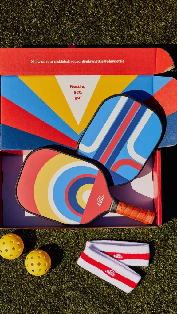 The Double Pack Set includes: 2 USA approved Paddles, 2 Pickleballs, 2 Sweatbands and a canvas carrying bag