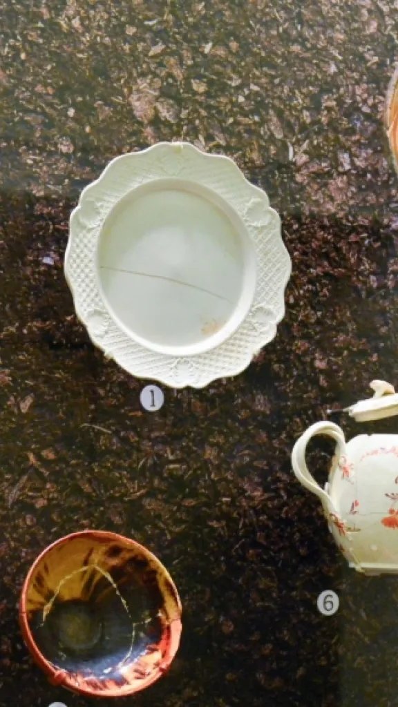 A display case at the Museum of the American Revolution features ceramics and pottery found under the Museum build site.