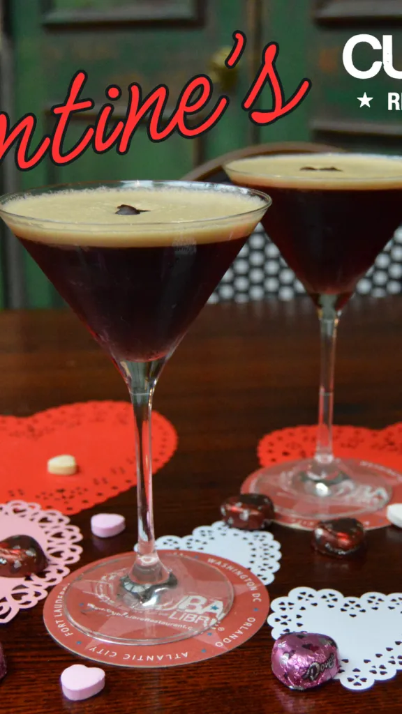 Two espresso martinis on a table decorated with heart coasters and chocolates; Galentine's and $7 espresso martini text