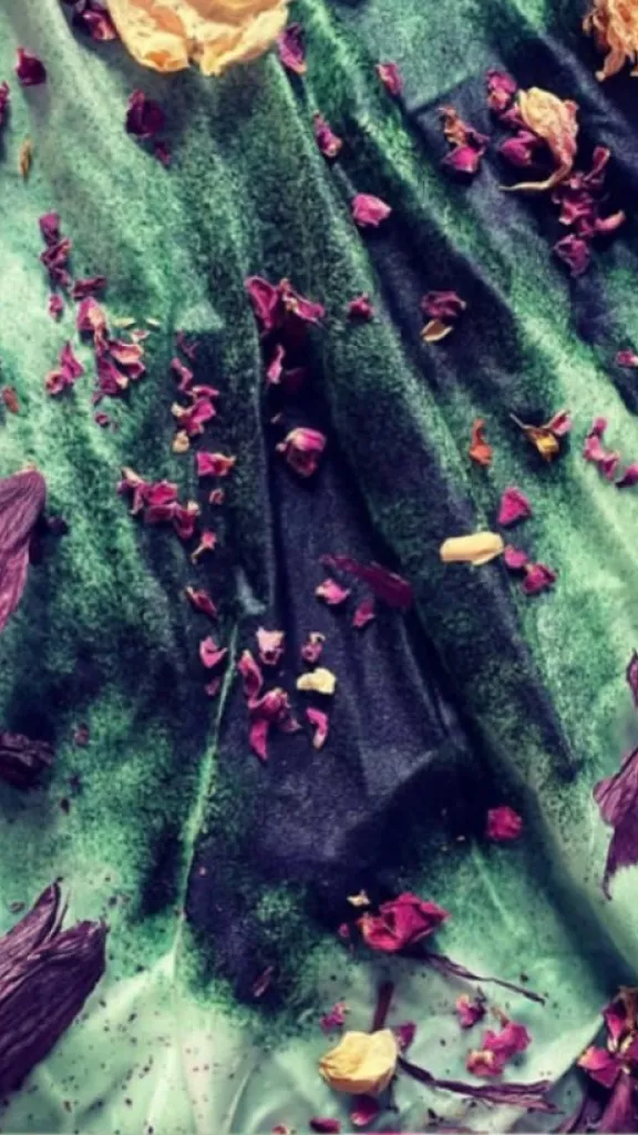 Plant dyeing in progress using rose petals, botanicals, and seeds