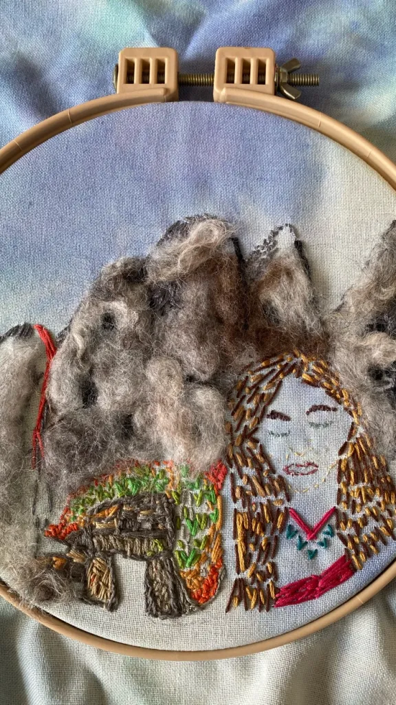 Embroidery hoop showing stitches to create texture and line 