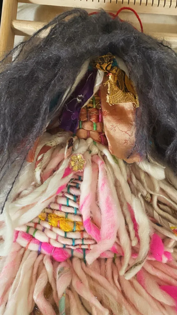 Doll sculpture made on small loom with farm sourced and recycled fibers 