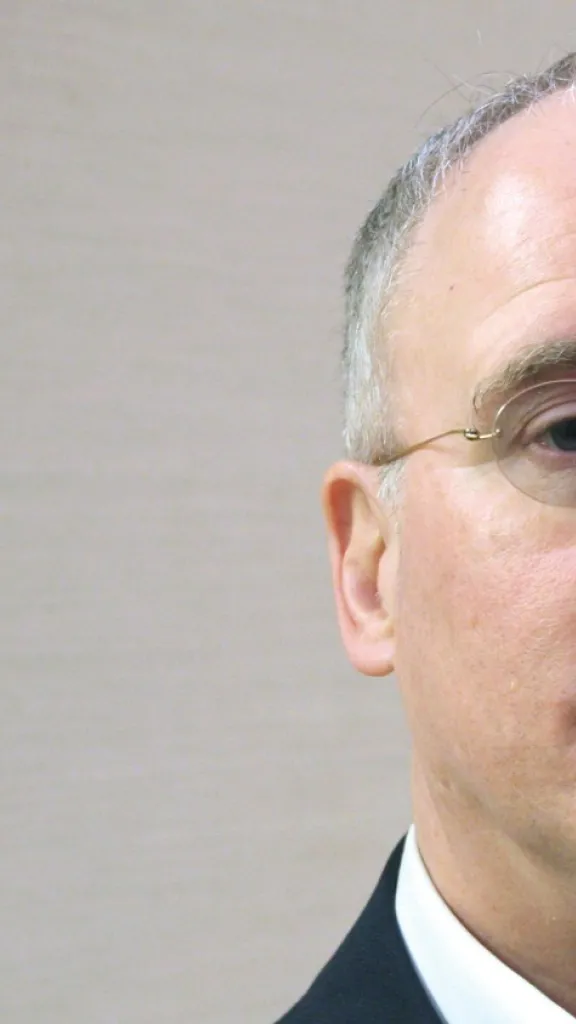 Graphic that reads "Read the Revolution" on the left and a photo of a white middle aged male wearing glasses on the right