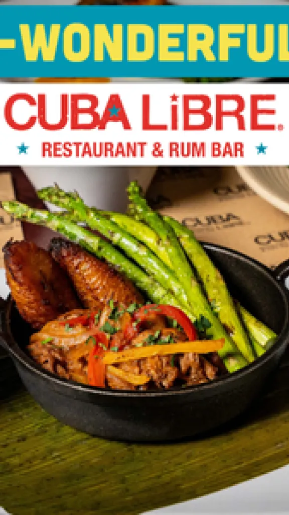 GLP-Wonderful Ropa Vieja entree with asparagus on the side, flanked by one small bowl of white rice and one small bowl of black beans