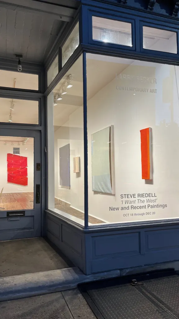 Larry Becker Contemporary Art storefront window with STEVE RIEDELL's Solo exhibition of New and Recent Paintings:  'I Want the West'