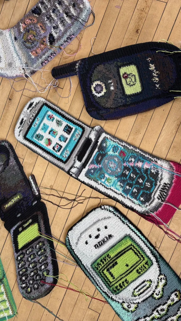 Collection of oversized crochet cell phones from early 2000's
