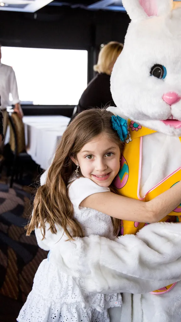 Child hugging Easter Bunny