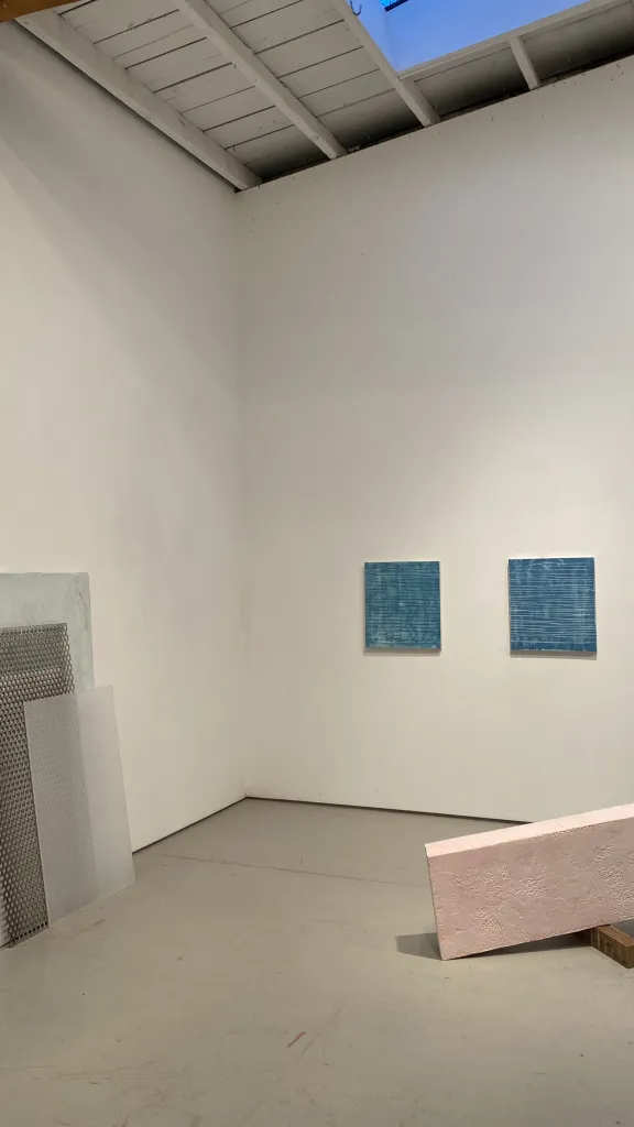 Studio installation view of two recent sculptures by Alan Greenberg  and two recent paintings by Stuart Fineman which will be included in the exhibition at LBCA.