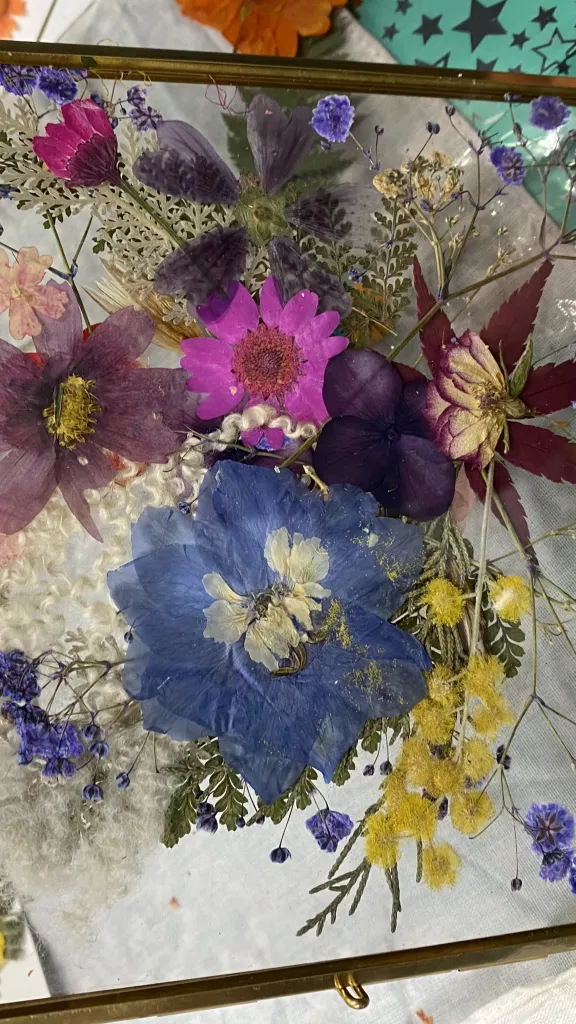 Workshop participant showing off her botanical design 