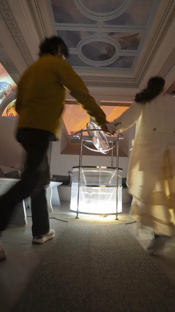 A Priestess in The Heavens guides a visitor through the space painted by Meg Saligman with interactions created by Spatial Pixel artists (Violet Whitney and William Martin).