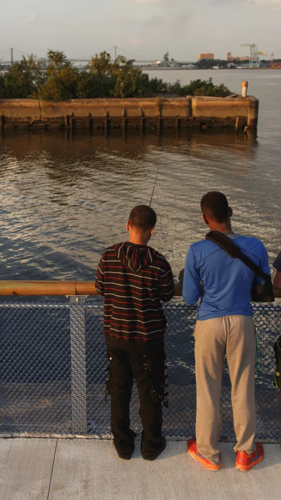 Group of friends fishing at Pier 68