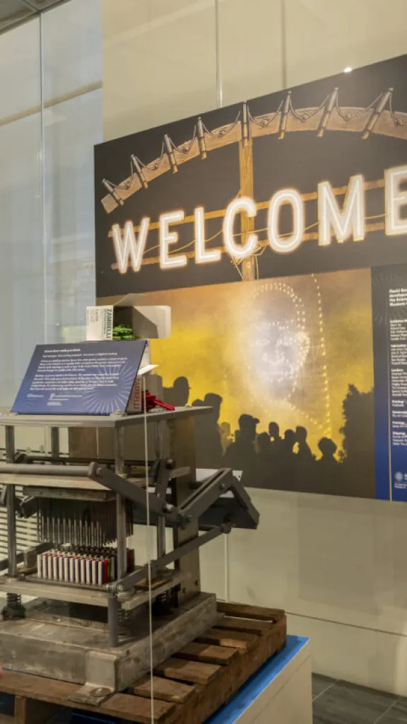 woman viewing an exhibition on fireworks history